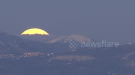 Full supermoon rises above France’s Alpes-Maritimes in end-of-year spectacle