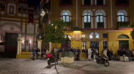 Long queue at the doors of the Basílica de la Macarena in Seville, Spain