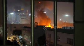 Fire with explosions erupts in outdoor parking lot in Guangzhou, China
