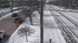 Train crashes into car stuck on crossing in Illinois