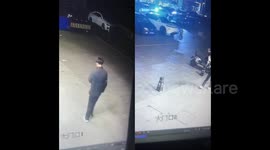 China: Man Casually Steps onto Parking Bollard and Sits Cross-Legged While on Phone