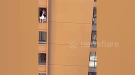 Mistress nearly falls to her death while hiding from lover's wife on 10th-floor window