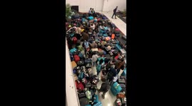 Long lines and piled luggage amid IndiGo disruption in Delhi, India