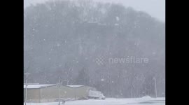 Blizzard-like snowfall reduces visibility in Rockingham, Virginia, USA