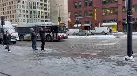 Falling ice narrowly misses pedestrians in Chicago, USA