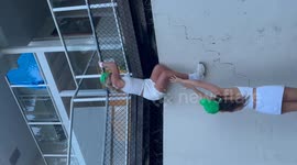 Australia: She Climbed the Fence for a Tennis Ball Then Forgot How to Get Down