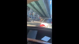 Traffic cop directs cars using extra-large red hands