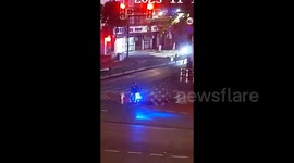 Toddler strays into busy road in search of mum before being whisked to safety by passing motorcyclist