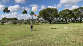 Meteorologists launch weather balloon for atmospheric data collection in Miami, Florida, USA