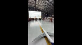 Toddler who dreams of being a pilot marshalls a remote-controlled Boeing 777