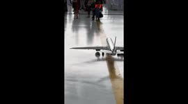 Toddler who dreams of being a pilot marshalls a remote-controlled Boeing 777