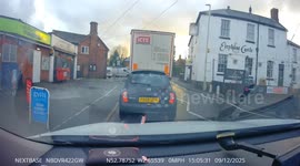 Driver pulls up between traffic lights
