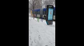 Snowy winter conditions along E Washington Ave in Minneapolis, USA