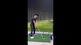 Man accidentally strikes a full basket of golf balls in Guangzhou, China