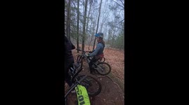 Dog Leaps Onto Mountain Biker