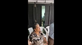 Grandma Trying Her Best at a Cup Game