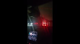 Semi Truck Slides Across Highway in Freezing Rain and Rolls Into Ditch