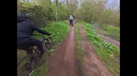 Two Mountain Bikers Nearly Land on Each Other