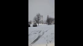 Steady snowfall during winter weather event in Geneseo, New York, USA