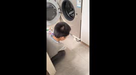 Boy spins toy car in washing machine in Gansu, China