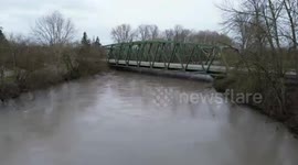 Nooksack River swells with fast floodwaters along SR 539 in Lynden, USA