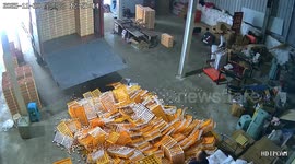 Chaos as worker's mishap triggers 'egg landslide' as hundreds of boxes crashing to floor