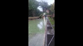 Boy slips during bicycle ride on rainy bike lane in Caracas, Venezuela