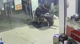 Shop worker knocked over when e-bike crashes into shop's glass door