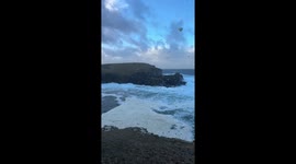 UK: Sea Foam Covers Yesnaby Shoreline as Storm Bram Brings Rough Waves