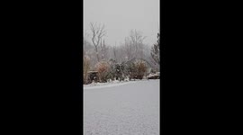 Heavy snowfall transforms rural landscape during winter storm in Hampton, USA