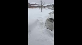 Knee-deep lake-effect snow during winter storm in Ontario, Canada