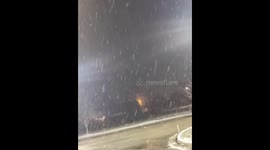 Gentle snow falls at night in Nicholasville, Kentucky, USA