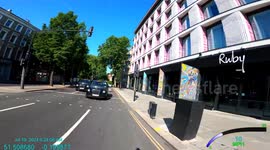 Terrifyingly Close Call: Taxi Driver's Dangerous Overtake on Cyclist! He runs his cab along the end of the bike handlebar,