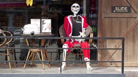 Santa Claus Skeleton with his Dog at a Cannabis Dispensary in Thailand