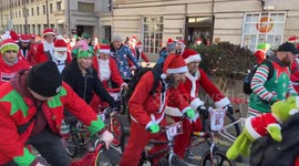 Hundreds of Santas ride for charity in London