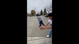 Playful football block leads to funny fall in California, USA
