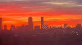 Vivid winter sunrise lights up the Boston skyline in Cambridge, Massachusetts