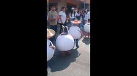 Child in egg costume stumbles during local parade in Acayucan, Mexico