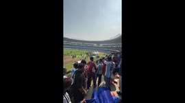 Angry fans throw chairs from upper tier of the stadium in Lionel Messi Kolkata event.