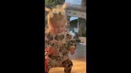 Baby JoJo drops it low in viral living-room dance