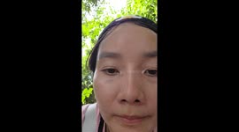 Mountain porters carry camping bags and equipment as they scale steep trail