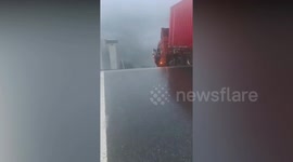 Lucky trucker narrowly escapes death after left hanging off collapsed bridge