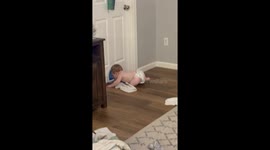 Baby makes sneaky escape as he crawls through parents' cat flap