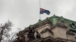 Flag flies at half-mast at Australia House in central London as flowers and candles are laid for victims of the Bondi Beach terrorist attack