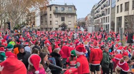 Thousands of Santa-dressed people flood Paris suburb for Christmas Corrida race