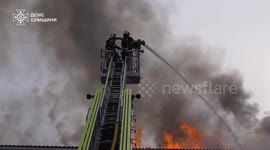 Ukrainian emergency crew extinguishes fire caused by Russian airstrikes in Sumy