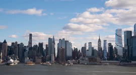 TIMELAPSE - Sun sets behind Manhattan skyline and George Washington Bridge in NYC
