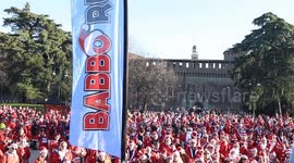 Hundreds of Santas bring early Christmas cheer to Milan