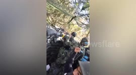 Thai soldiers celebrate as they capture temple on disputed border area