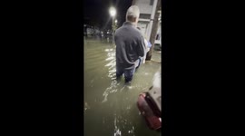 Women Films Family Walking Through Atlantic City Flood At Check In